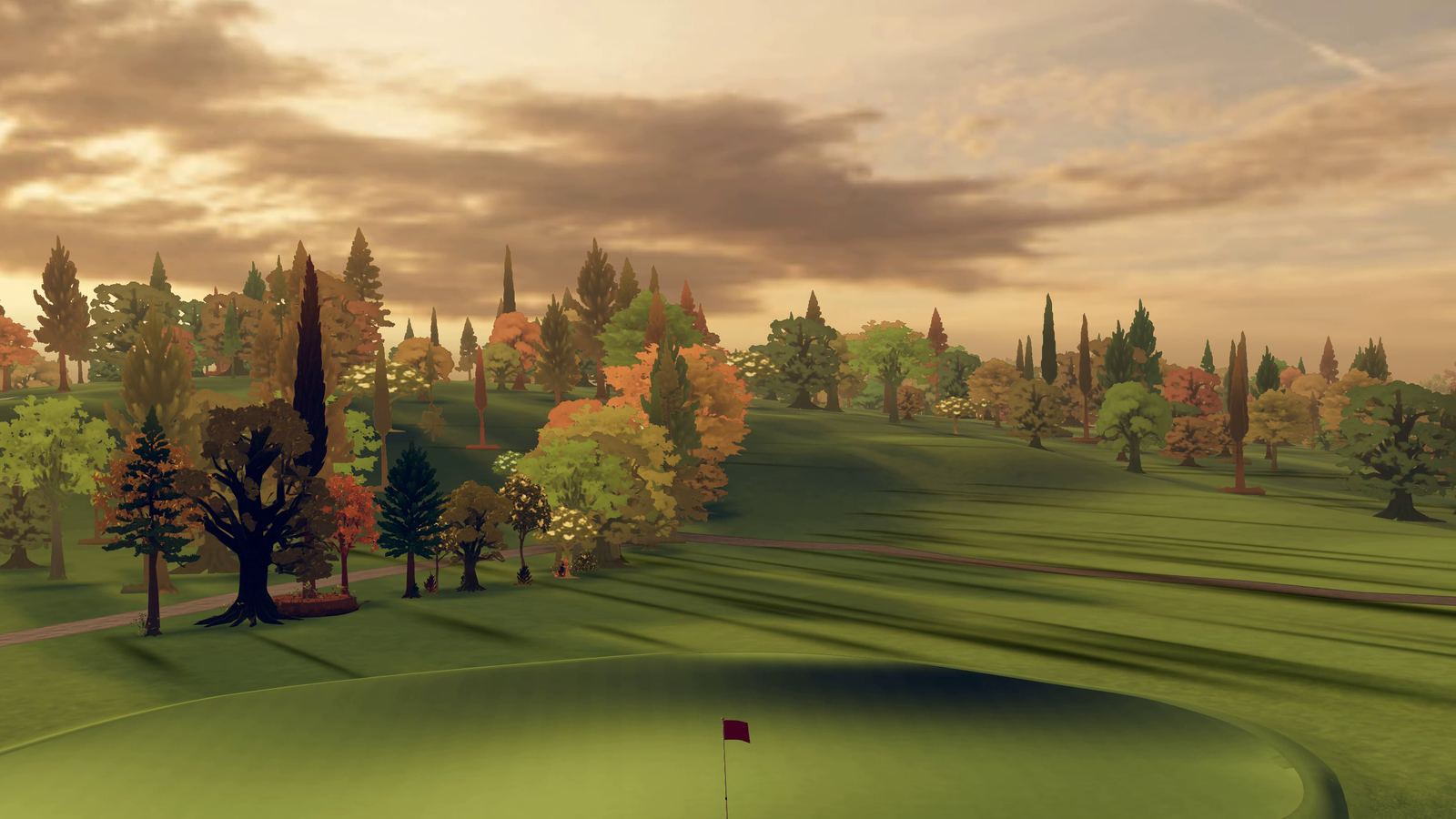 Flying in over the green and its flag toward rolling fairways, a cart path and autumn trees under a copper sky
